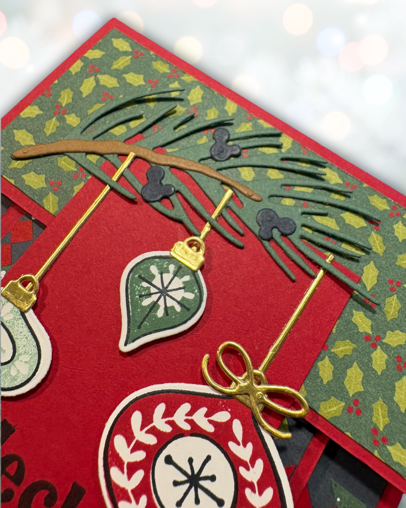 Christmas card with pine branch and hanging ornaments