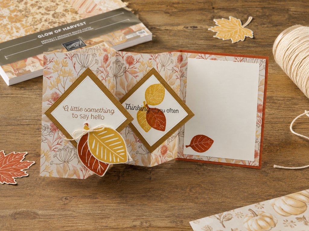 Accordion fun fold fall card with diamond panels stamped 'A little something to say hello' and 'Thinking of you often,' surrounded by fall leaves and Glow of Harvest designer paper